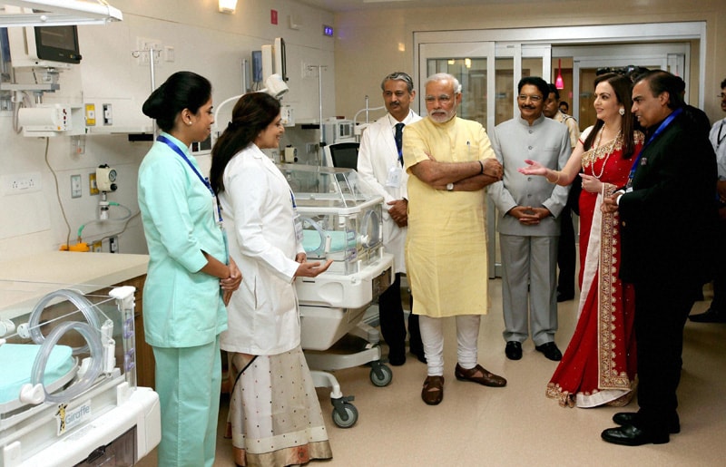 PM Narendra Modi is welcomed by Reliance Industries' Nita Ambani and Mukesh Ambani on his arrival for the re-dedication and inauguration of HN Reliance Foundation Hospital in Mumbai. PTI