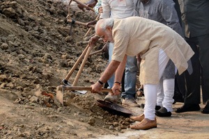 PM Narendra Modi wields a spade, cleans Assi Ghat of Ganga