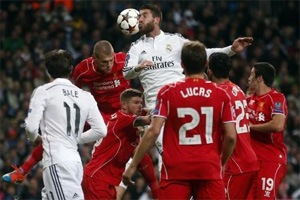 Real Madrid down Liverpool 1-0 to reach knockout round of Champions League