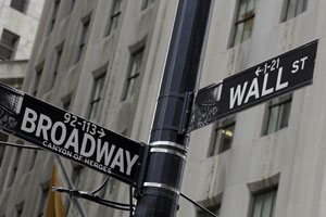 Central bank views boost dollar; Wall St ends flat