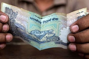 Indian rupee slips past psychological $63 mark to hit 13-month low