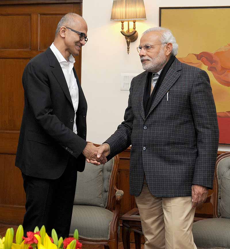 Prime Minister Narendra Modi shakes hands with Microsoft CEO Satya Nadella in New Delhi. PTI/PIB