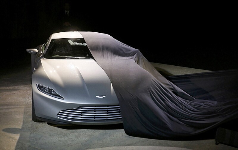 An Aston Martin DB10 car is unveiled on stage during an event to mark the start of production for the new James Bond film titled 'Spectre'. Reuters