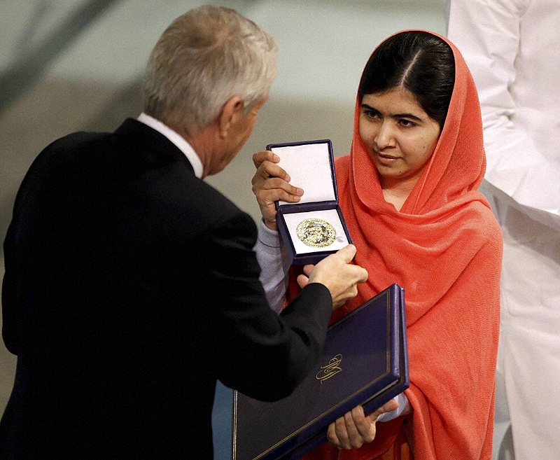 Nobel Peace Prize winner Malala Yousafzai from Pakistan receives her award from Chair of the Norwegian Nobel Committee, Thorbjorn Jagland during the Nobel Peace Prize award ceremony. (AP/PTI)