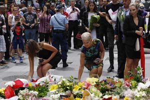 Police storm Sydney cafe to end hostage siege; 3 dead including gunman Police storm Sydney cafe to end hostage siege; 3 dead including gunman