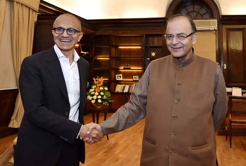 Finance Minister Arun Jaitley shakes hands with Microsoft CEO Satya Nadella during a meeting in New Delhi. PTI