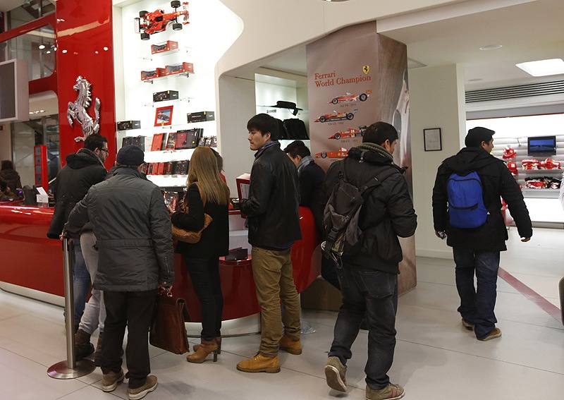 People queue at a cash desk of a Ferrari Store. (AP)