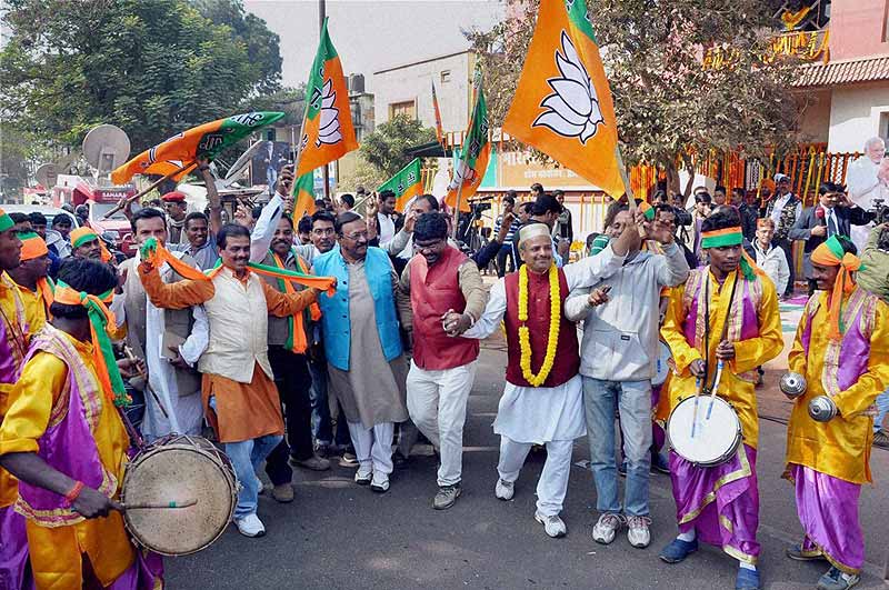 BJP party workers celebrate after Jharkhand Assembly election results declared at state party office, Harmu in Ranchi. (PTI)