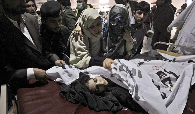Relatives of a victim of Taliban attack in school attack mourns after her death at a hospital in Peshawar, Pakistan. AP