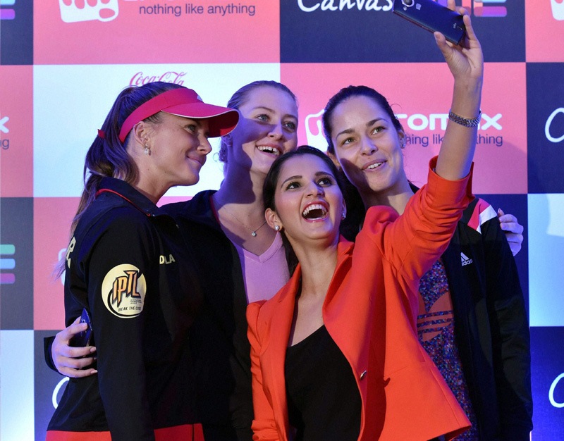 Tennis Champions Daniela Hantuchová, Ana Ivanovic, Sania Mirza and Kristina Mladenovic take selfies with the newly launched Micromax Canvas Hue in New Delhi on Monday. (PTI)