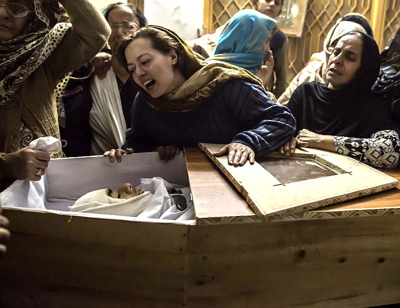 A mother mourns her son Mohammed Ali Khan, 15, a student who was killed during an attack by Taliban gunmen on the Army Public School, at her house in Peshawar December 16, 2014. (Reuters)