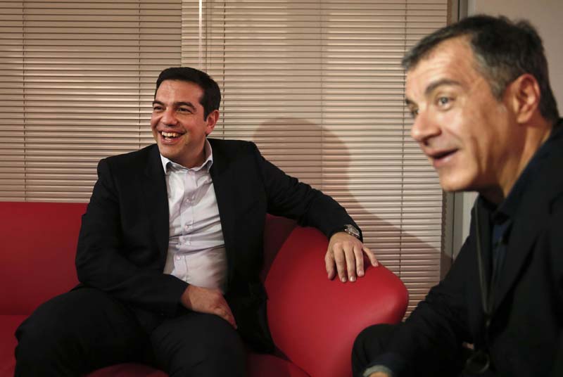 The alliance between Syriza and the Independent Greeks - two ideologically opposed parties who share only their opposition to the bailout - boosted stock markets across Europe that had fallen on news of the uncertain election results and fear of a second election. After a topsy-turvy session in Athens, stocks closed 3.2 percent down. Syriza won 36.3 percent of the vote in Sunday's early general elections, 8.5 percentage points ahead of former Prime Minister Antonis Samaras' conservatives. Nazi-rooted Golden Dawn, whose leadership is in prison awaiting trial for allegedly running a criminal organization, came third at 6.3 percent. The Independent Greeks have pledged to support Syriza in Parliament with its 13 lawmakers, party leader Panos Kamenos said. Syriza officials said the Independent Greeks would take certain cabinet positions, although no details have been revealed so far. Tsipras has promised to renegotiate Greece's massive bailout agreements, but insists he will not take any unilateral action against lenders from other eurozone countries and the IMF. <br><i>Caption: Greece's newly-appointed Prime Minister Alexis Tsipras (L) meets with Greek centrist party To Potami (River) leader Stavros Theodorakis at the radical leftist Syriza headquarters in Athens January 26, 2015.(Reuters)</i></br>