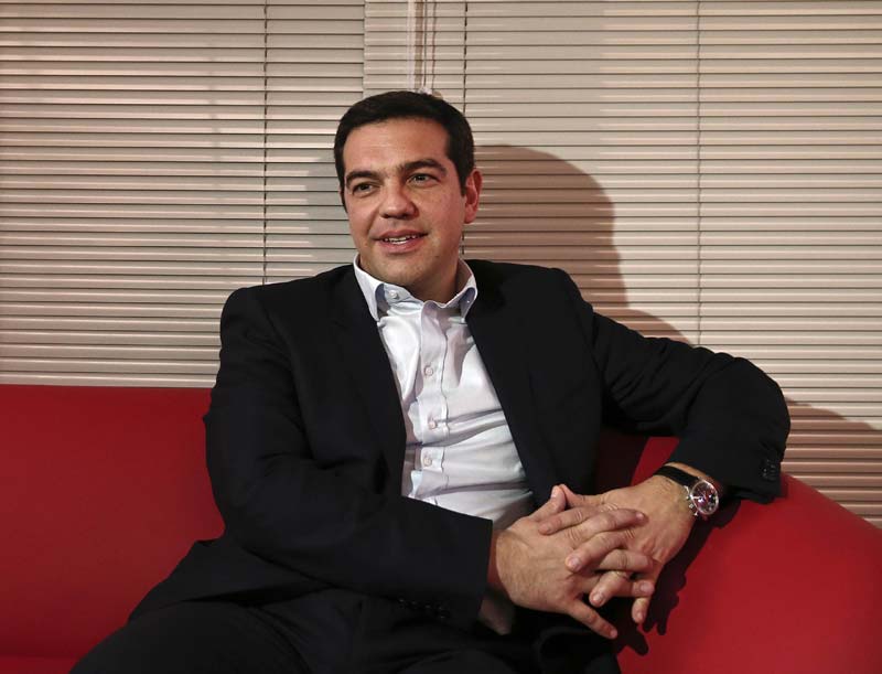 Tsipras' choice to deal with the nationalist Independent Greeks - a party aligned in Europe with the UK Independence Party - rather than the centrist Potami caused concern that he could take a tough line in negotiations with rescue lenders. Potami leader Stavros Theodorakis described the Independent Greeks as ''far right and anti-European.'' Syriza's financial planning official, Giorgos Stathakis, confirmed Monday that the new government had no plans to meet with negotiators from the ''troika'' of the European Central Bank, the European Commission and the International Monetary Fund and would instead seek talks directly with governments. Greek voters swung to the once-marginal left-wing party after five years of punishing austerity measures demanded under 240 billion euro ($268 billions) bailout deals threw hundreds of thousands of people out of work and left nearly a third of the country without state health insurance. Thousands of supporters turned out to watch Tsipras speak in central Athens after his opponents conceded. ''The Greek people have written history,'' he said, to cheers. ''Greece is leaving behind the destructive austerity, fear and authoritarianism, it is leaving behind five years of humiliation and pain.'' <br><i>Caption: Greece's newly-appointed Prime Minister Alexis Tsipras looks on during a meeting with Greek centrist party To Potami (River) leader Stavros Theodorakis (not pictured) at the radical leftist Syriza party headquarters in Athens January 26, 2015. (Reuters)</i></br>