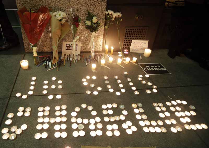 The words "I am Charlie" are spelled out with candles at a gathering in solidarity with those killed in an attack at the Paris offices of the weekly newspaper Charlie Hebdo. (AP)