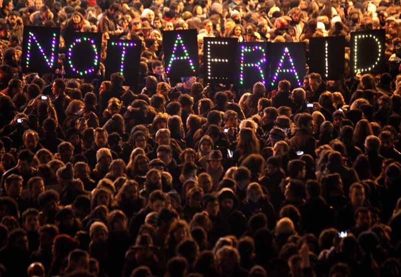 People came out in huge numbers on roads protesting against terrorist attack on the office of Charlie Hebdo in Paris. (AP)