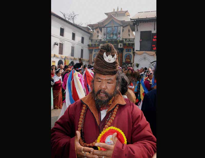 A holy man performs rituals at Pashupathi Nath temple on the occasion of Mahashivratri festival in Kathmandu on Tuesday. (PTI)