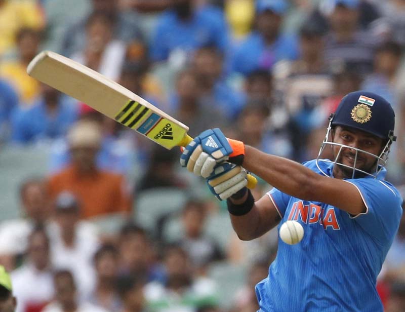 Suresh Raina, india pakistan, india pakistan match photo, india vs pakistan, india pakistan match, india pakistan match photos, match pictures ind pak, india pakistan world cup, india pakistan world cup gallery, india pakistan gallery, cricket news, cricket