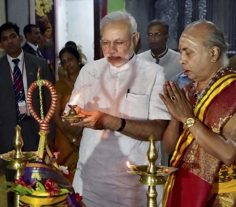 Prime Minister Narendra Modi offers prayers at a temple in Jaffna, Sri Lanka on Saturday. (PTI)