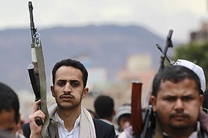 Shiite rebels, known as Houthis, hold up their weapons to protest against Saudi-led airstrikes, during a rally in Sanaa, Yemen. (AP)