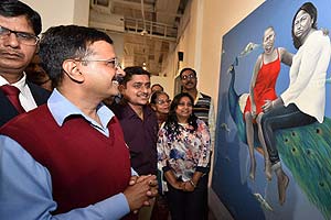 Delhi Chief Minister Arvind Kejriwal going around after inauguration of Women Art Exhibition in New Delhi on Friday. PTI