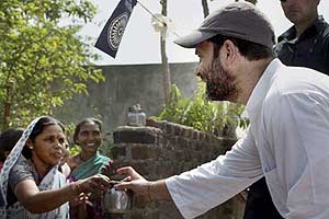 Congress vice-president Rahul Gandhi is offered water by a village woman during his 15-km padyatra in Amravati district in Vidarbha region of Maharashtra on Thursday. PTI