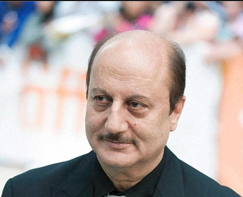 Veteran actor Anupam Kher on Monday took shots at Rahul Gandhi and said that although he did not doubt the latter's 'Indianness' but would likely to see him sing the National Anthem as he doubted if the Congress Vice President even knew the words. (PTI)