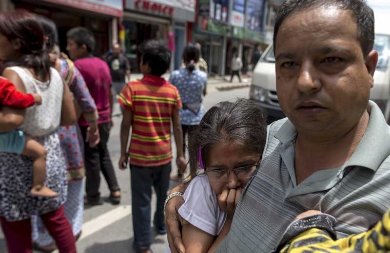 Local residents evacuate onto a street minutes after a fresh 7.3 earthquake struck, in central Kathmandu, Nepal. (Reuters)