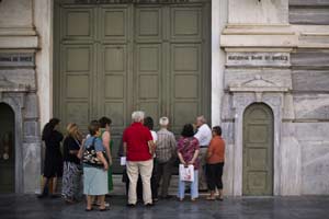 Greece's Parliament votes on Wednesday on an 85-billion-euro bailout deal meant to prevent the country's economy from collapsing. In the picture, pensioners wait for the opening of the national bank of Greece to withdraw a maximum of 120 euros ($134) for the week in central Athens on Wednesday, July 15, 2015. (Photo: AP)