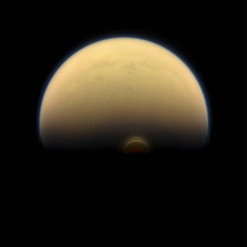 <br>NASA finds giant ice cloud on Titan</br> <br>NASA's Cassini spacecraft has detected a monstrous new cloud of frozen compounds in the low- to mid-stratosphere of Titan, the largest moon of Saturn. Cassini's camera had already imaged an impressive cloud hovering over Titan's south pole at an altitude of about 300 kilometres. However, that cloud, first seen in 2012, turned out to be just the tip of the iceberg. A much more massive ice cloud system has now been found lower in the stratosphere, peaking at an altitude of about 200 kilometres, NASA said. The new cloud was detected by Cassini's infrared instrument u2013 the Composite Infrared Spectrometer, or CIRS u2013 which obtains profiles of the atmosphere at invisible thermal wavelengths. The cloud has a low density, similar to Earth's fog but likely flat on top.</br> (Photo: NASA)