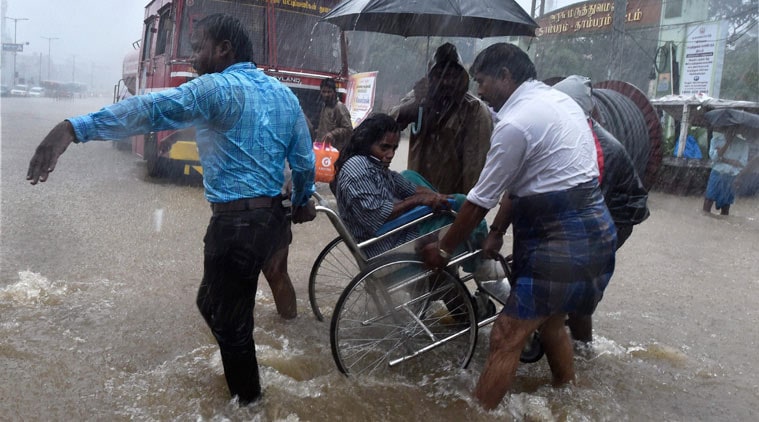 Chennai Floods: Signs of easing of situation in flood-battered Chennai emerged today with no fresh rains and a sharp fall in water levels of Adyar and Kumbh rivers that were in spate following torrential rains as rescue and relief operations continued in full swing and Prime Minister Narendra Modi announced a Rs 1,000 crore more aid to Tamil Nadu.<br>Image Caption: Prime Minister Narendra Modi conducting an aerial survey of Chennai floods, Tamil Nadu (PTI)</br>