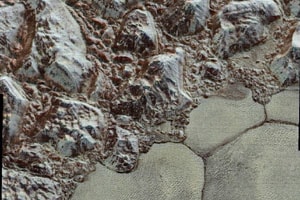 The images form a strip 80 kilometres wide, trending from the edge of 'badlands' northwest of the informally named Sputnik Planum, across the al-Idrisi mountains, onto the shoreline of Pluto's 'heart' feature, and just into its icy plains. (Source: NASA) The images form a strip 80 kilometres wide, trending from the edge of 'badlands' northwest of the informally named Sputnik Planum, across the al-Idrisi mountains, onto the shoreline of Pluto's 'heart' feature, and just into its icy plains. (Source: NASA)