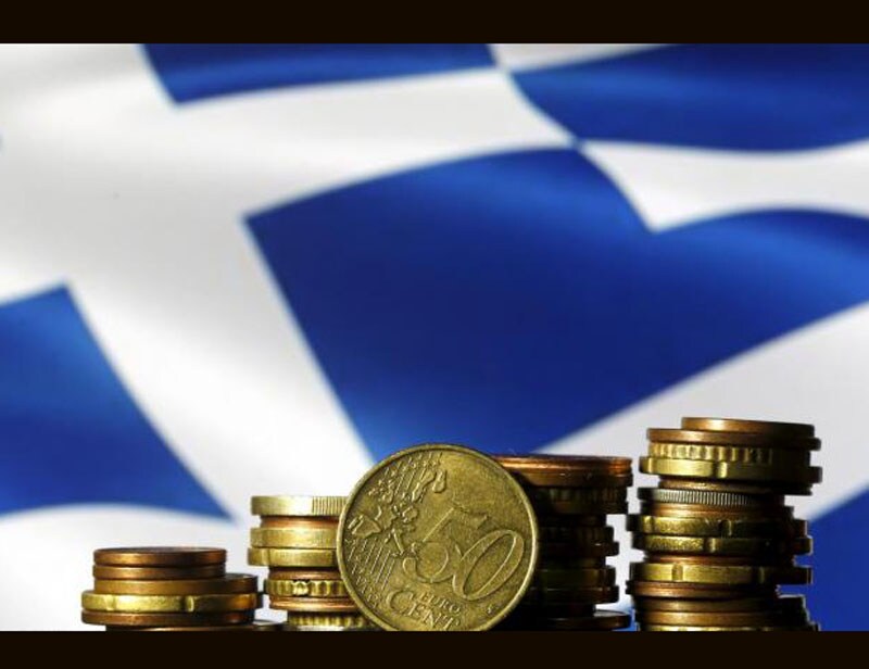 Greece economic crisis: Greece came closer than ever to crashing out of the euro, defaulting on an International Monetary Fund loan. A referendum on a third international bailout was called in late June after the Syriza government called off talks with creditors. Deep political turmoil ensued, finance minister Yanis Varoufakis resigned and capital controls were introduced. A bailout was eventually agreed weeks later, but not before 2-year Greek yields soared to 60 per cent and volatility spread through world markets. (Reuters photo) <br><a href="https://www.financialexpress.com/topic/year-ender-2015/"><strong>Full coverage: Year-Ender 2015</strong></a></br>