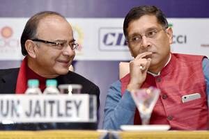 New Delhi: Finance Minister Arun Jaitley and Chief Economic Advisor Arvind Subramaniam at a session on "GST in India" jointly organised by CII, FICCI and ASSOCHAM in New Delhi on Wednesday. PTI Photo by Kamal Singh (PTI12_16_2015_000150B)