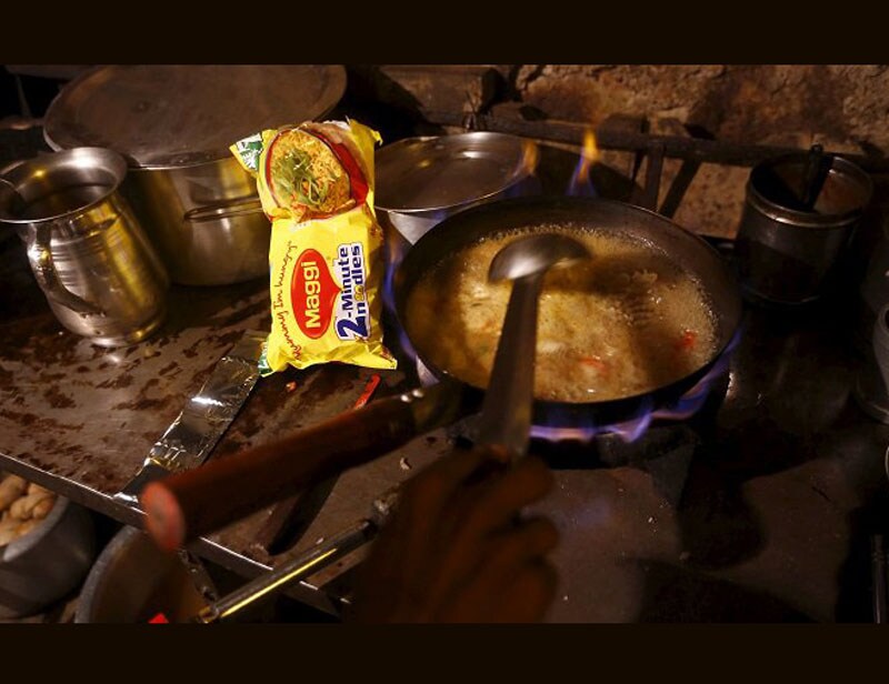 Maggi controversy: In June 2015 , FSSAI had banned Maggi noodles, claiming that it was "unsafe and hazardous" for consumption after finding lead content beyond permissible limits. Nestle is estimated to have taken a hit of Rs 450 crore and had to destroy over 30,000 tonnes of the instant noodles. Furthermore, Nestle India reported a standalone loss of Rs 64.40 crore in the April-June quarter for the first time in 15 years. (Reuters photo) <br><a href="https://www.financialexpress.com/topic/year-ender-2015/"><strong>Full coverage: Year-Ender 2015</strong></a></br>