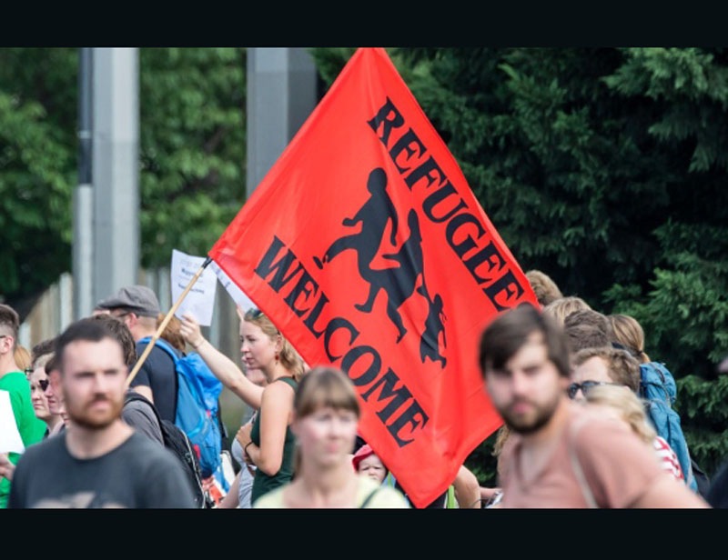 This year's influx of migrants to Europe has proven to be perhaps Angela Merkel's toughest test yet. Germany has been the top destination for people fleeing Syria, Afghanistan, Iraq and elsewhere in hopes of safety and a better life. The flow picked up after Merkel decided in early September to let in people stuck in Hungary. Germany has struggled to house and process the newcomers - some 965,000 were registered as asylum-seekers between January and November. Still, Merkel has stuck to her optimistic insistence that ''we will manage it'' and refused to name a limit to the number of people Germany can take in, despite mounting criticism from conservative allies. She has pushed - to little avail so far - for more help from other European countries in sharing the burden, and insists that the crisis can only be solved through patient diplomacy. (AP photo)