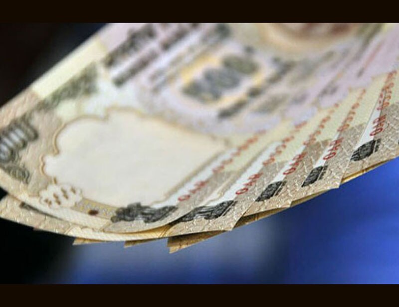 Indian Rupee: Owing to factors such as US Fed rate hike worries, China yuan devaluation in August and some foreign money outflow, the Indian rupee is set for the fifth straight year of fall in 2015. The Indian currency seems to have found a new bottom after hovering between two extremes of being billed the world's worst as well as the best performing currency and the experts see the range of 65-70 as the new normal. (AP photo) <br><a href="https://www.financialexpress.com/topic/year-ender-2015/"><strong>Full coverage: Year-Ender 2015</strong></a></br>