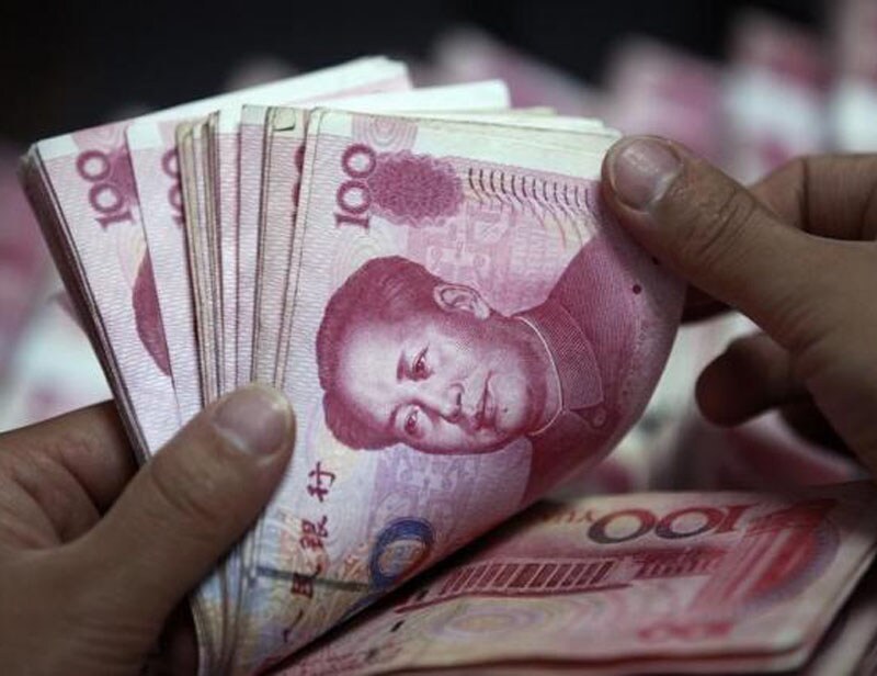 China crisis: Worries over China's economy peaked in the middle of this year, resulting in a 45 per cent plunge in Chinese stocks, accelerated capital flight and a record fall in FX reserves. Selling was fueled by the perception that Beijing was increasingly powerless to halt the tide despite taking a wide range of measures. Beijing devalued the yuan on August 11. (Reuters photo) <br><a href="https://www.financialexpress.com/topic/year-ender-2015/"><strong>Full coverage: Year-Ender 2015</strong></a></br>