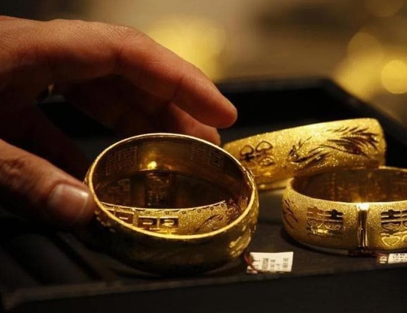 12. Can I encash the Sovereign Gold Bond Scheme anytime I want? Is premature redemption allowed? Though the tenor of the bond is 8 years, early encashment/redemption of the bond is allowed after fifth year from the date of issue on coupon payment dates. The bond will be tradable on Exchanges, if held in demat form. It can also be transferred to any other eligible investor. (Image Source: Reuters)