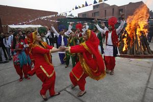 Bonfires, an important part of Lohri festivities, was lit as several families danced to the tunes of famous festival songs like 'Sundariye Mundariye Ho', among others. (Reuters)