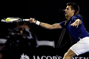 Novak Djokovic of Serbia plays a forehand return to Andy Murray of Britain during the men's singles final at the Australian Open tennis championships in Melbourne. (AP Photo)