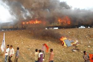 East Godavari: Agitators belonging to the Kapu caste set fire to Ratnachal Express when it halted at Tuni railway station in East Godavari district on Sunday afternoon, they were protesting to demand their caste for inclusion in the backward class. PTI Photo(PTI1_31_2016_000184A)