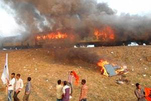 East Godavari: Agitators belonging to the Kapu caste set fire to Ratnachal Express when it halted at Tuni railway station in East Godavari district on Sunday afternoon, they were protesting to demand their caste for inclusion in the backward class. PTI Photo(PTI1_31_2016_000184A)