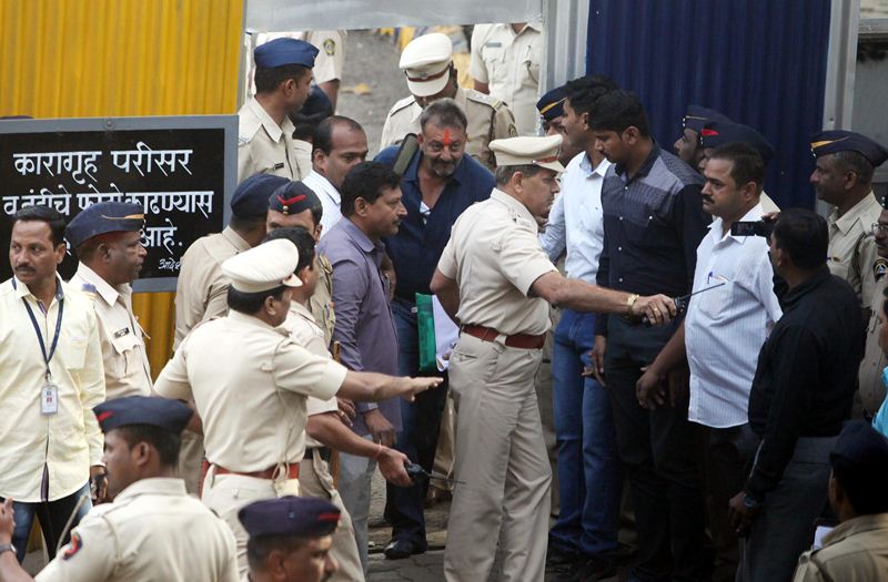 Sanjay Dutt was set free after completing prison formalities at around 8.45 AM and came out escorted by police which had tightened security in the area. He completed 42-months remaining of his five year sentence in Yerawada prison here as he had already spent 18 months in Mumbai's Arthur road jail as an under-trial. Controversies continued to dog him for his leave of parole and furlough as his critics and detractors alleged that the actor had been given "special treatment" that led to his remission and a curtailed stay in prison. (Express Photo)