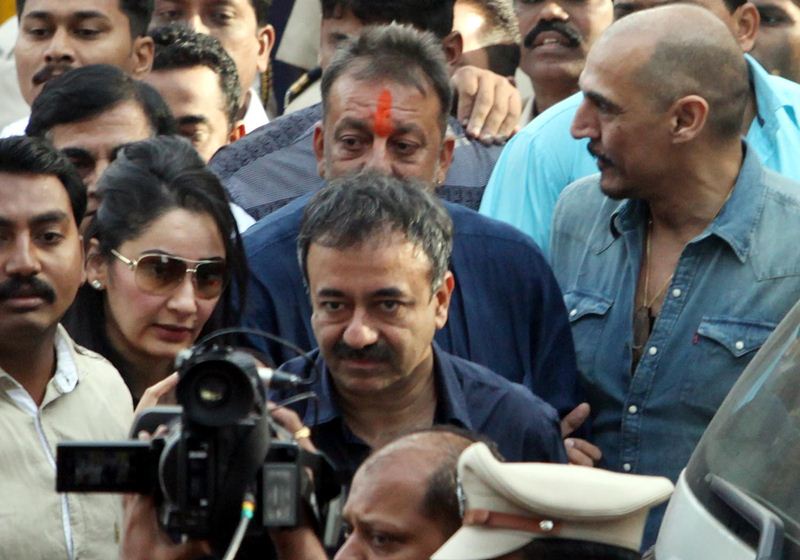 A sense of dramatics crept in as Sanjay Dutt turned back and saluted the tri-colour atop the prison building and bent to touch the soil in full media glare. Waiting for him inside the car were his wife Maanyata and friend and producer of blockbuster "Munnabhai" Rajkumar Hirani as he drove to Pune airport to take an onward chartered flight to Mumbai. Speaking to reporters outside the Pune airport, the actor quipped that "There is no easy walk to freedom my friends". (Express Photo)