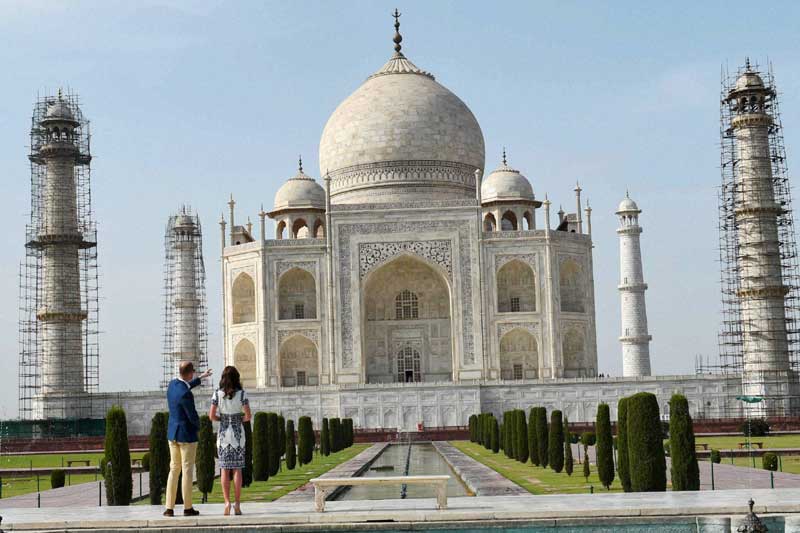 Ahead of the British royals' visit to the Taj Mahal, about a dozen armed policemen entered the complex and the left section was cordoned off. Ordinary tourists were allowed to enter the building from the right. The royal couple caused a great deal of excitement, with dozens of people taking pictures on their cellphones. (PTI)