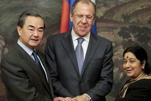 From left: Chinese Foreign Minister Wang Yi, Russia Foreign Minister Sergey Lavrov and Indian Foreign Minister Sushma Swaraj shake hands after a meeting in Moscow, Russia, Monday, April 18, 2016. (Source: AP) From left: Chinese Foreign Minister Wang Yi, Russia Foreign Minister Sergey Lavrov and Indian Foreign Minister Sushma Swaraj shake hands after a meeting in Moscow, Russia, Monday, April 18, 2016. (Source: AP)