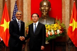 US President Barack Obama shaking hands with Vietnam's President Tran Dai Quang. (Reuters)