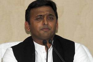 With opposition BJP and Congress fuming over photographs of the CM on the ration cards, Akhilesh has sought to downplay the issue, saying it was important for people to know who was working for them. (Reuters)
