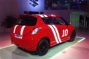 On the exterior, the accessorized version features white racing stripes on hood, white wing mirror covers, number ‘10’ stickers on the boot lid, front and rear doors, black alloy wheels and a rear spoiler.