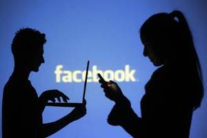 Photo-syncing was an optional feature Facebook launched on iOS in 2012 which allowed users to automatically copy all their photos from their smartphone to a private album on Facebook. (Reuters)